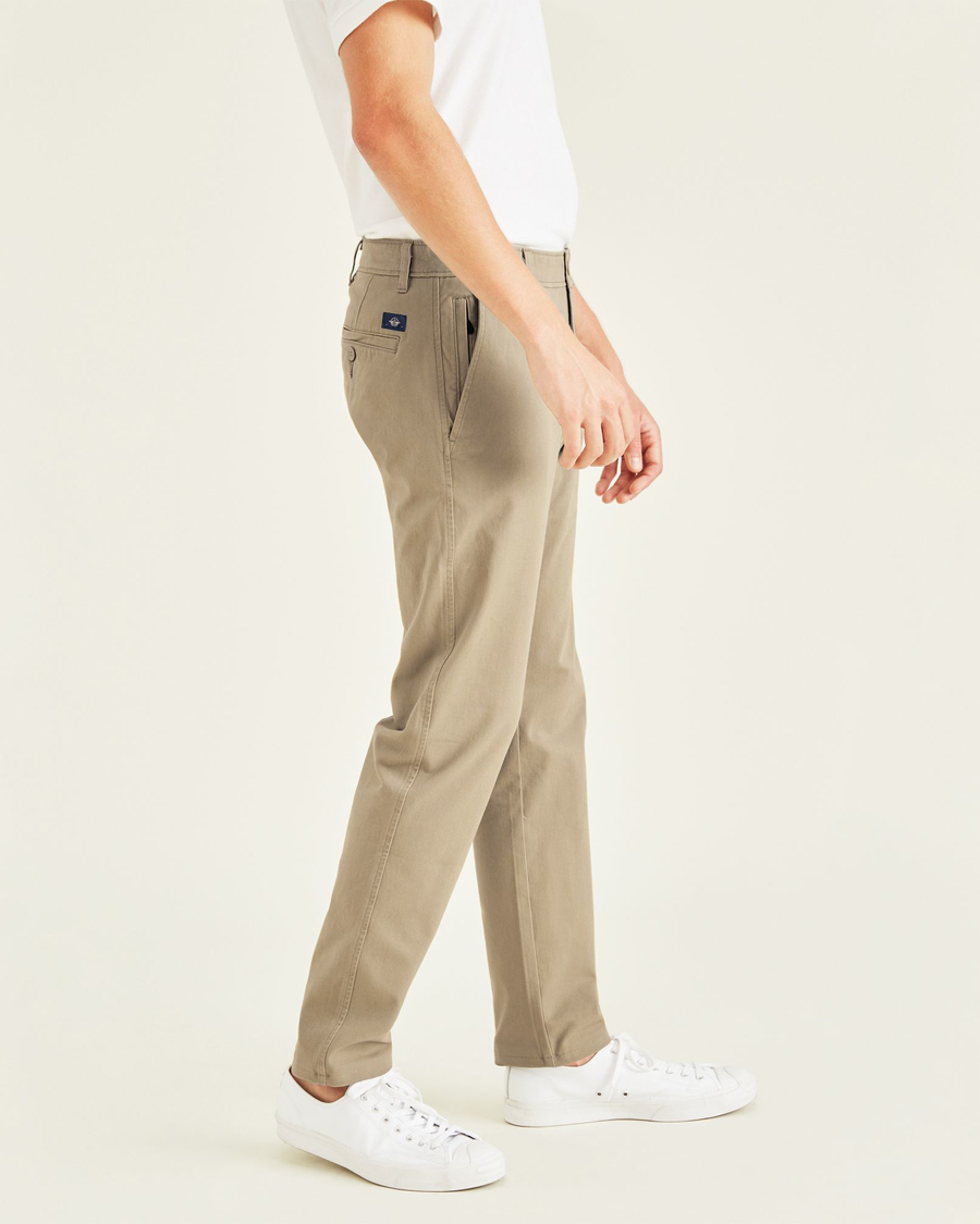 Side view of model wearing New British Khaki Ultimate Chinos, Slim Fit.