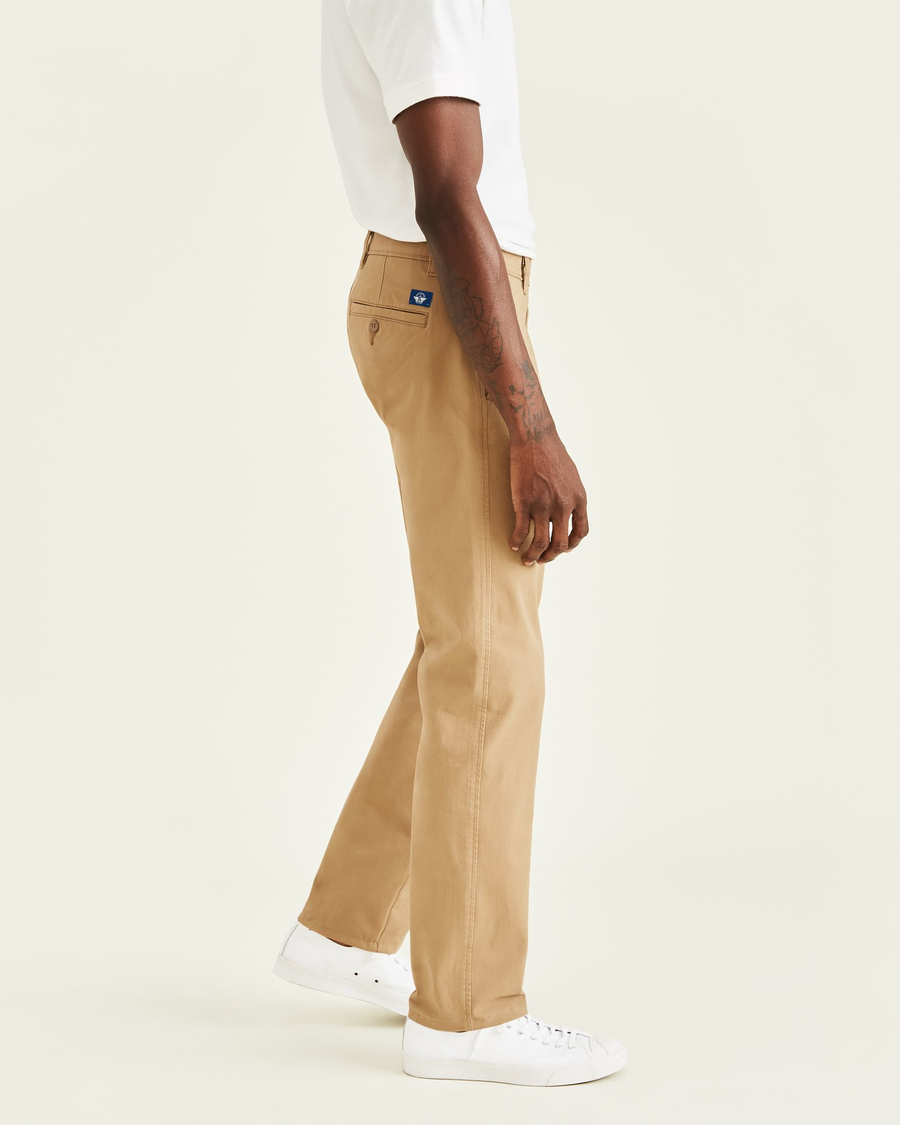 Side view of model wearing New British Khaki Ultimate Chinos, Straight Fit.