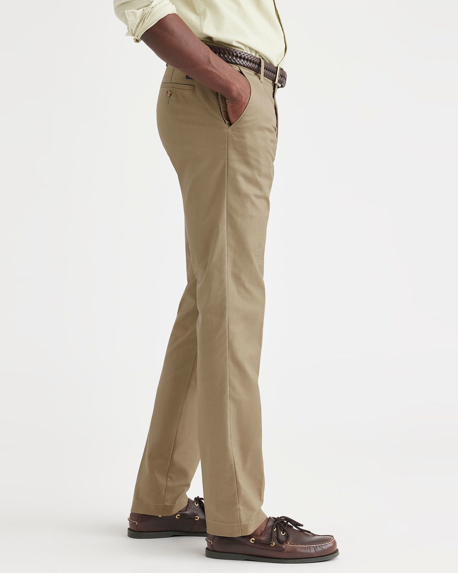 Side view of model wearing New British Khaki Workday Khakis, Slim Fit.