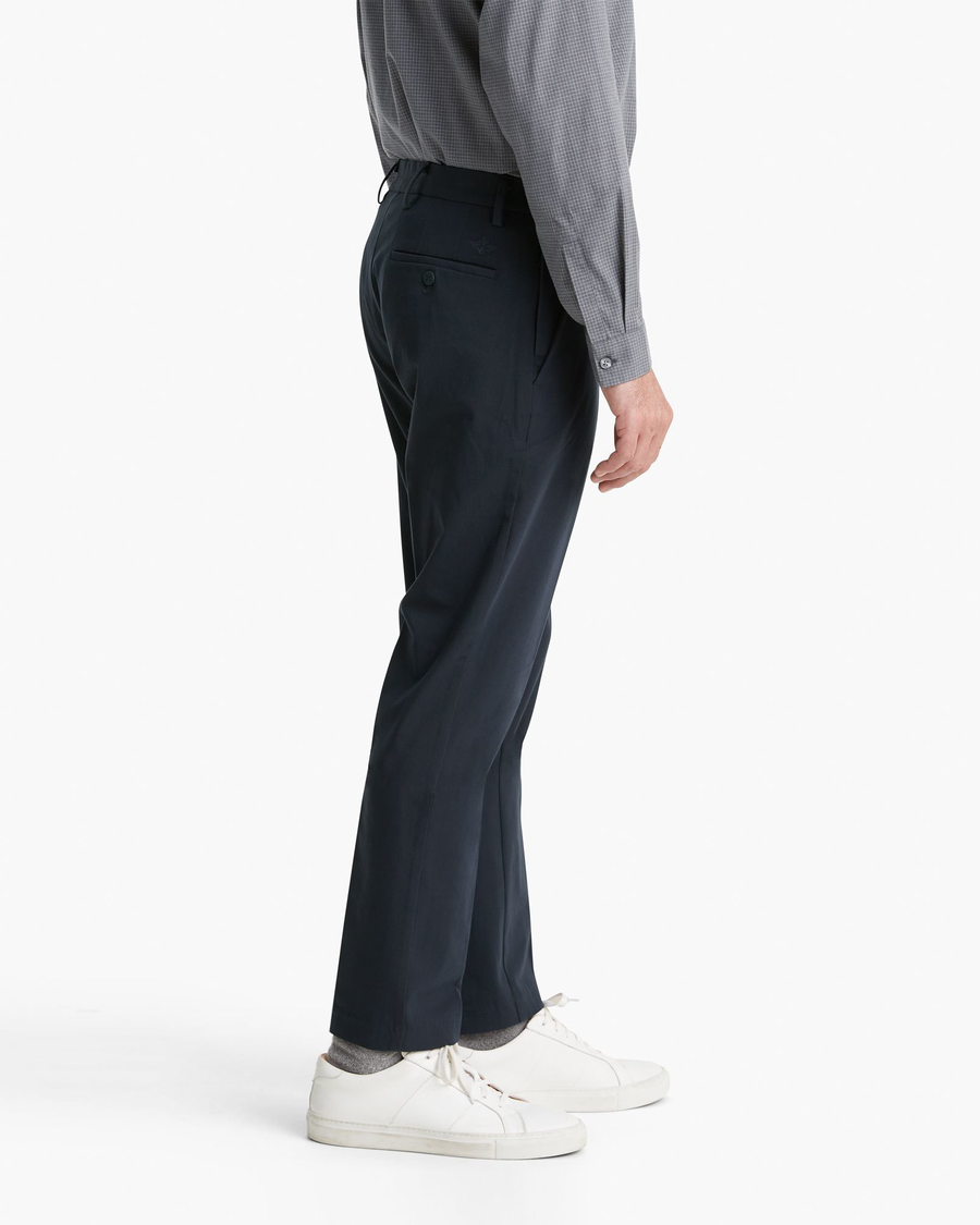 Side view of model wearing Nightwatch Blue City Tech Trousers, Slim Fit.