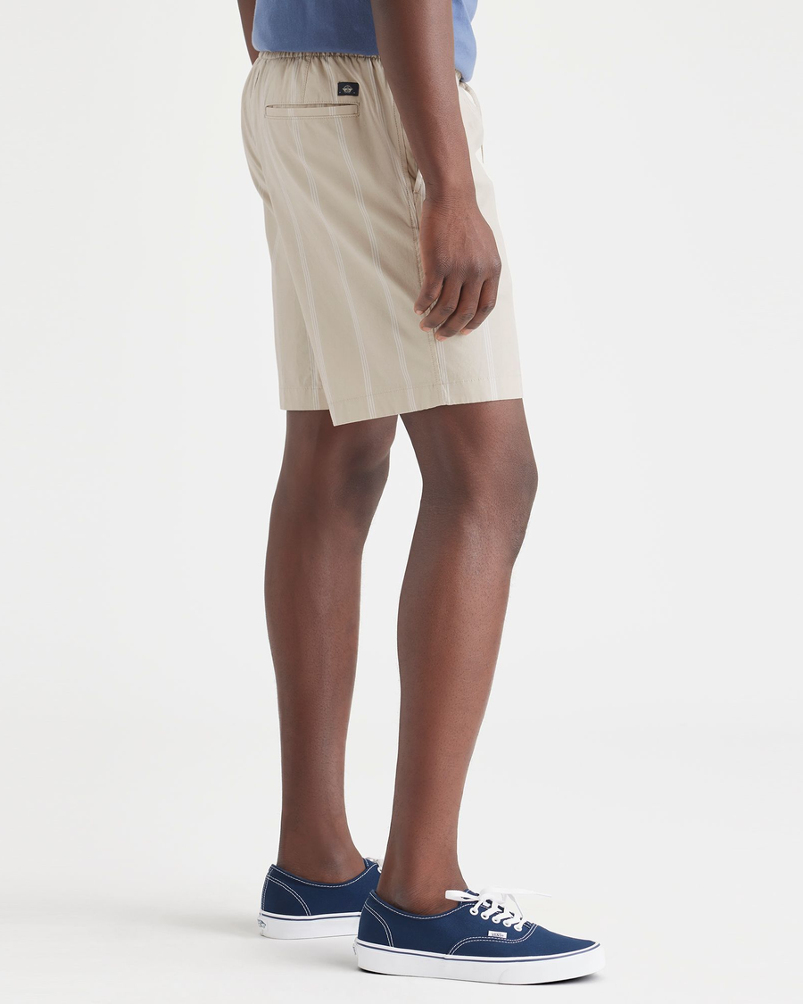 Side view of model wearing Nomad Sahara Khaki Ultimate Pull On 8.5" Short.