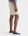 Side view of model wearing Nomad Sahara Khaki Ultimate Pull On 9.5" Shorts.