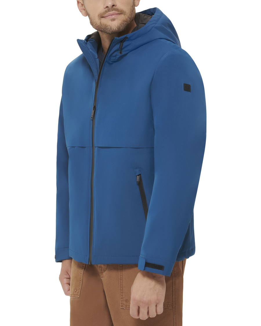 Side view of model wearing Ocean Blue Flex Tech Welded Flange Hoodie.