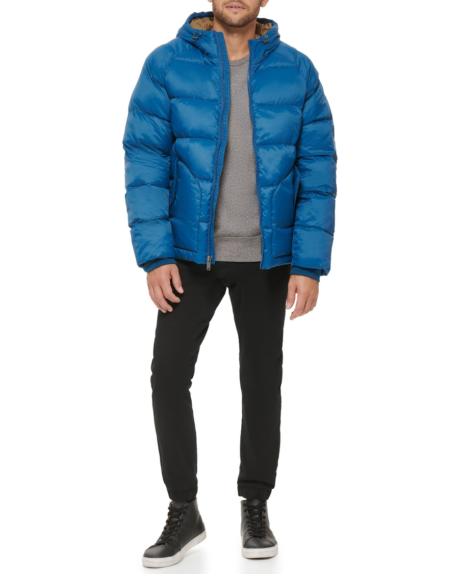 View of model wearing Ocean Blue Recycled Nylon Puffer Parka.
