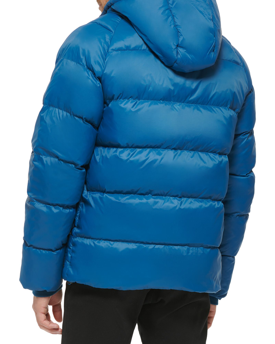 Back view of model wearing Ocean Blue Recycled Nylon Puffer Parka.