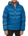 Front view of model wearing Ocean Blue Recycled Nylon Puffer Parka.