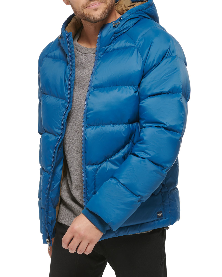 Side view of model wearing Ocean Blue Recycled Nylon Puffer Parka.