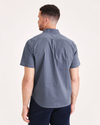 Back view of model wearing Ocean Blue Signature Comfort Flex Shirt, Classic Fit (Big and Tall).