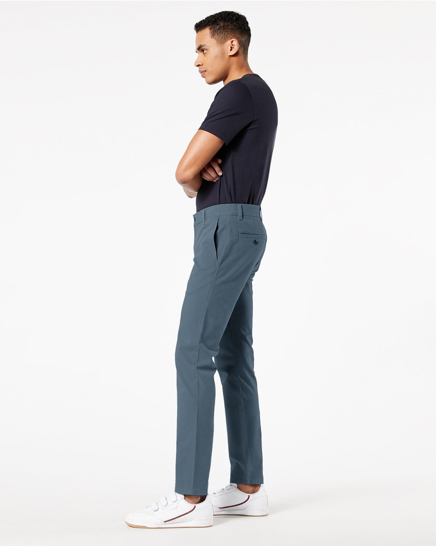 Side view of model wearing Oceanview Ultimate Chinos, Skinny Fit.