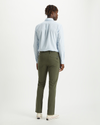 Back view of model wearing Olive Alpha Khakis, Skinny Fit.