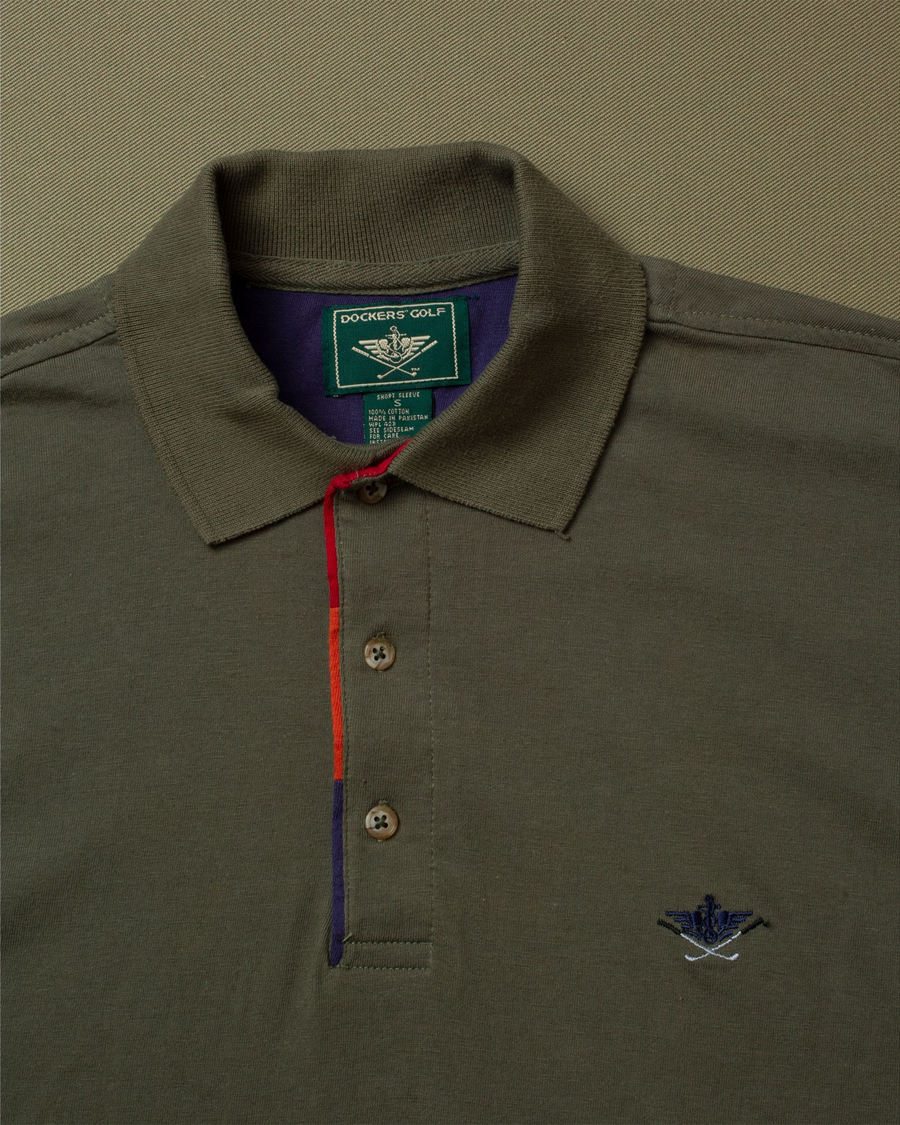 View of model wearing Olive Dockers® Golf Polo, Standard Fit - L.