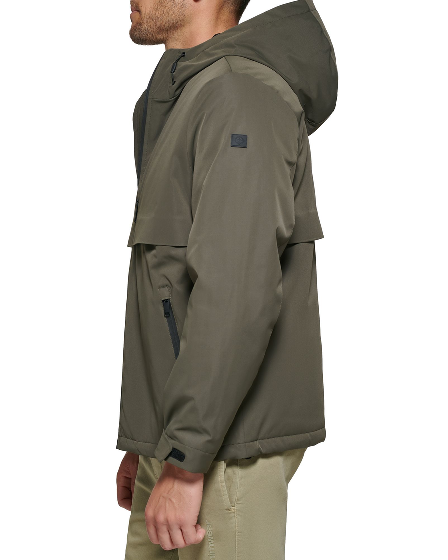 Side view of model wearing Olive Flex Tech Welded Flange Hoodie.