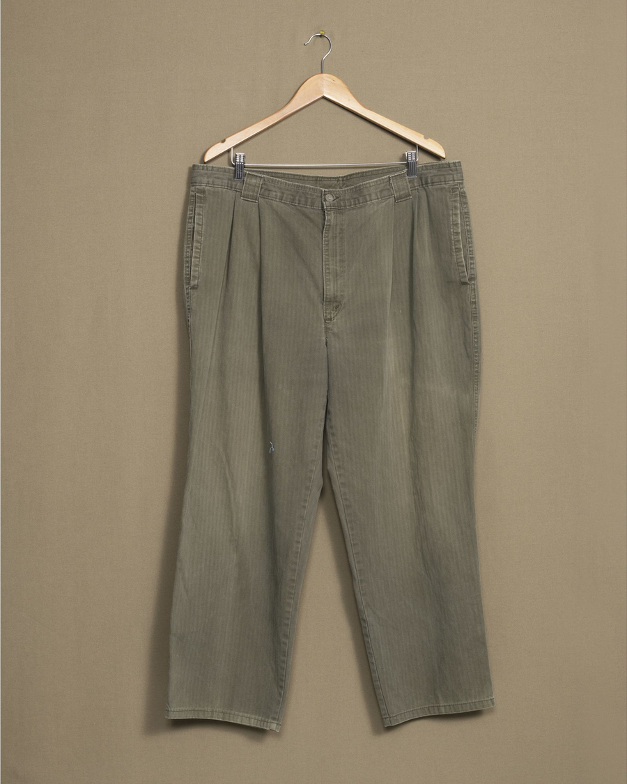 Front view of model wearing Olive Made in USA Pants, Olive Herringbone Double Pleated Pants - 38 x 27.