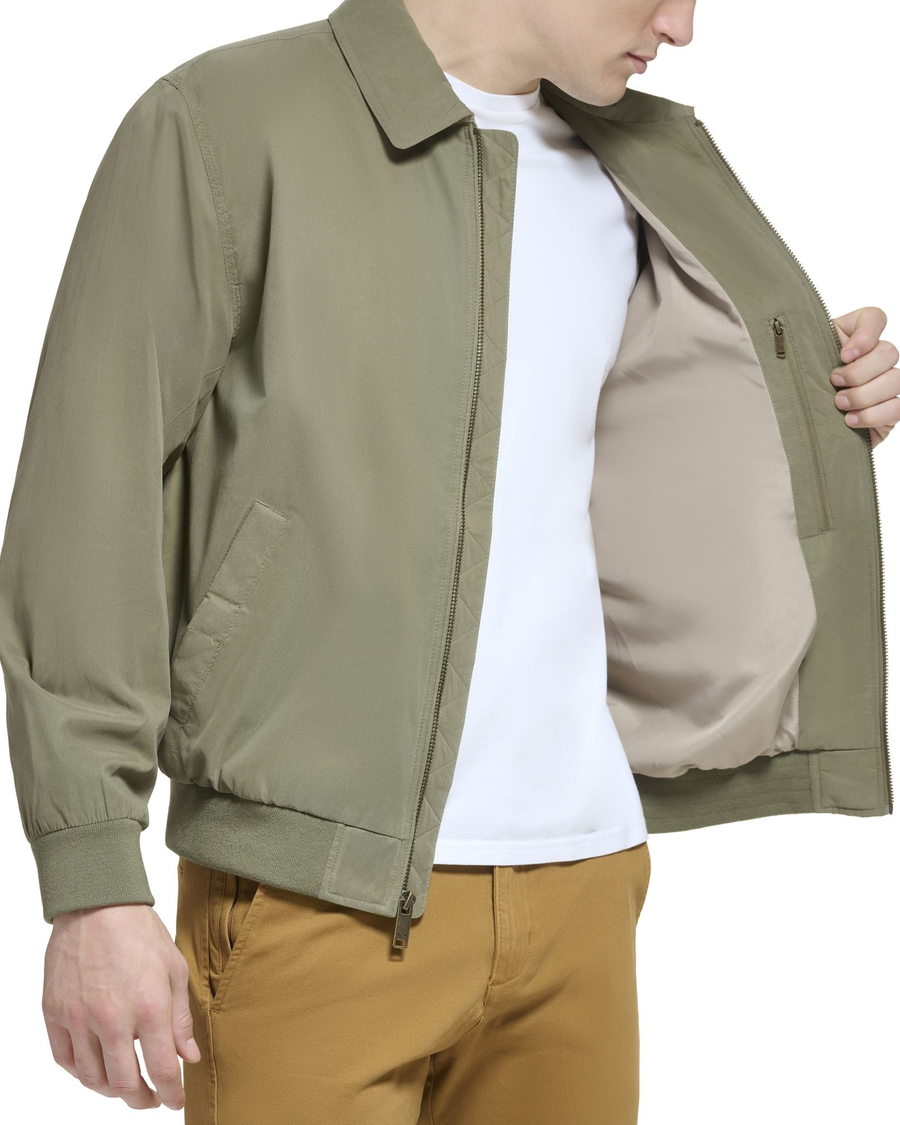 View of model wearing Olive Microtwill Relaxed Bomber Jacket.