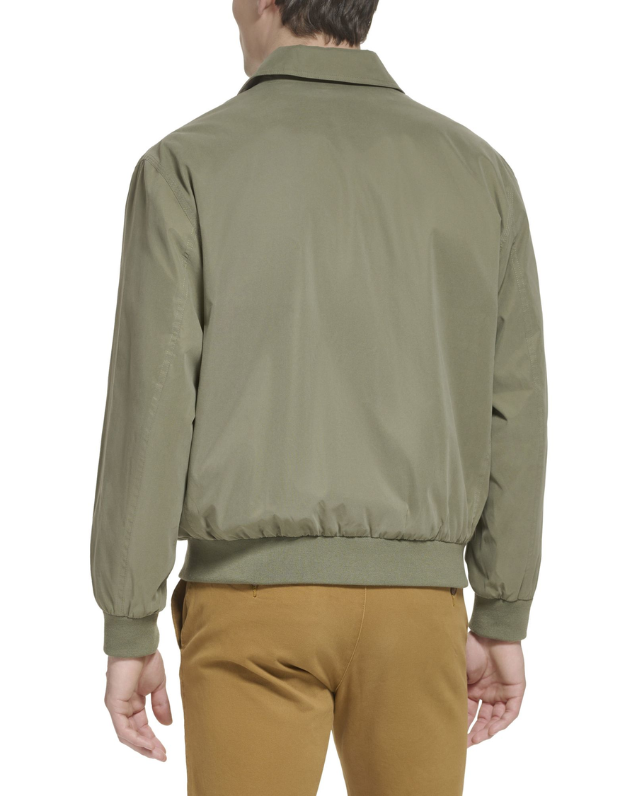 Back view of model wearing Olive Microtwill Relaxed Bomber Jacket.
