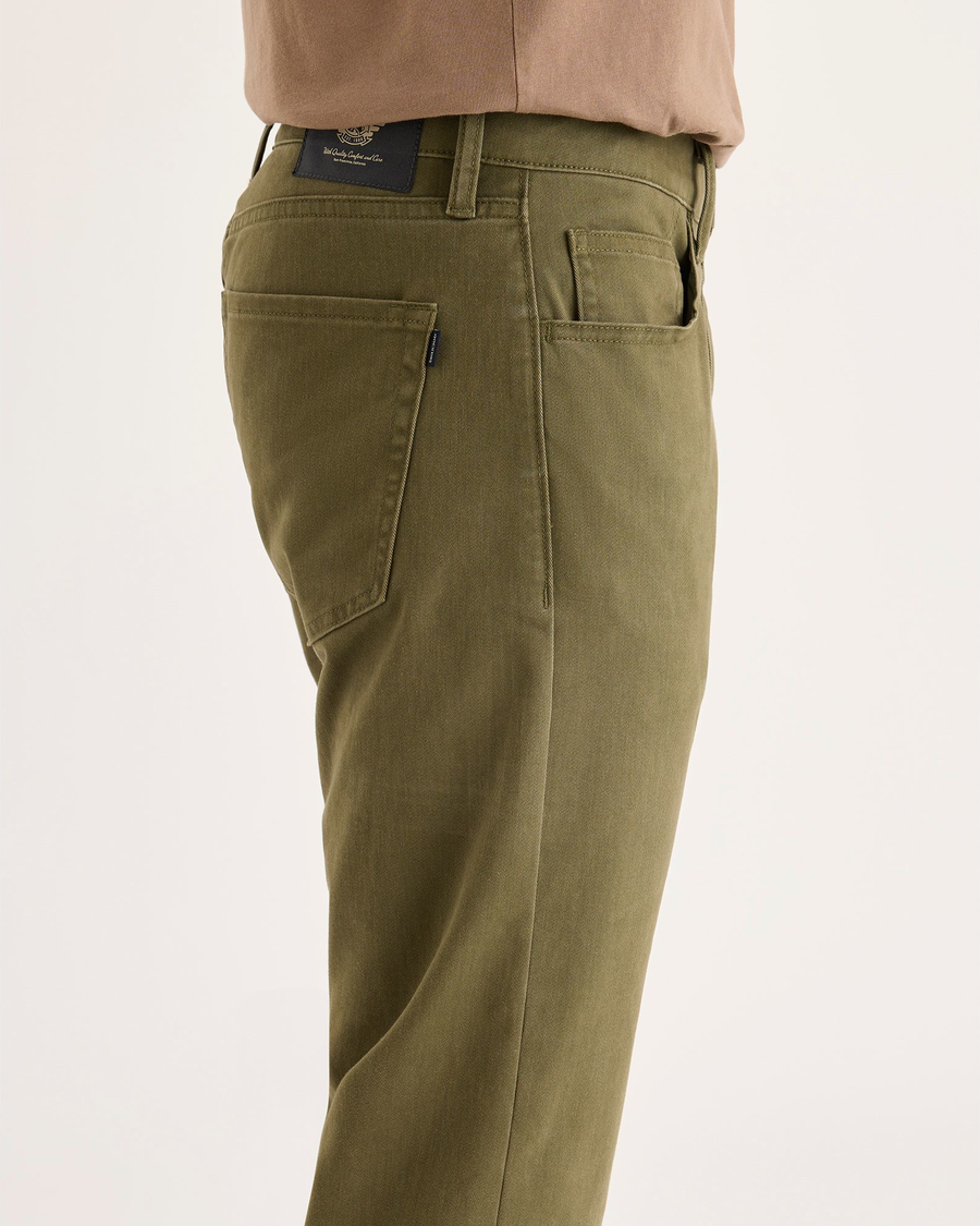Side view of model wearing Olive Night All-Day 5-Pocket, Slim Fit.