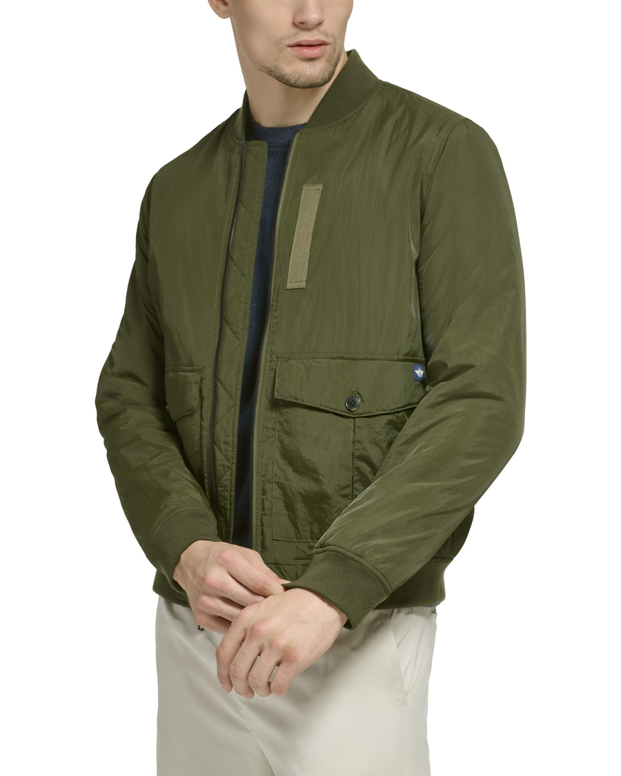 Side view of model wearing Olive Recycled Dry Touch Nylon Bomber.