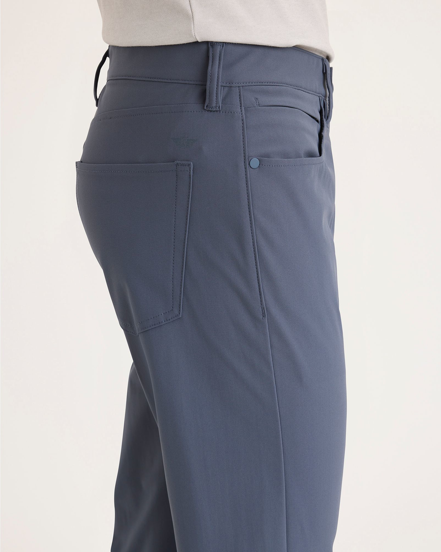 Side view of model wearing Ombre Blue Go Airweave Chino, Slim Tapered Fit.