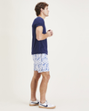 Side view of model wearing Orient Blue Playa 7" Shorts.