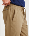 View of model wearing Otter Stone Canvas California Pull-On Khakis, Straight Tapered Fit.