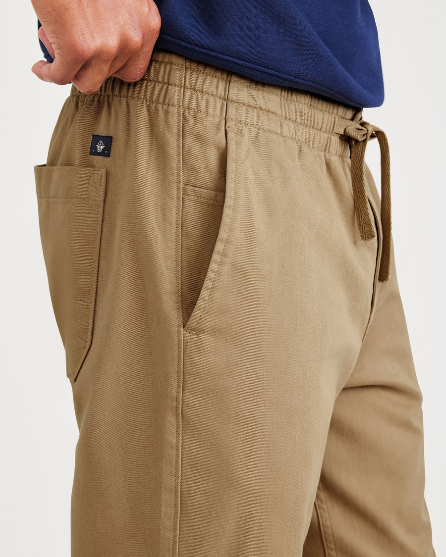 View of model wearing Otter Stone Canvas California Pull-On Khakis, Straight Tapered Fit.