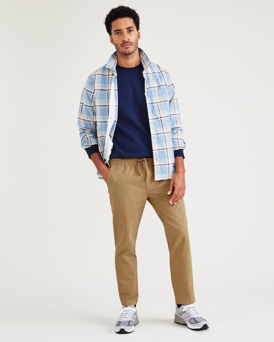 View of model wearing Otter Stone Canvas California Pull-On Khakis, Straight Tapered Fit.