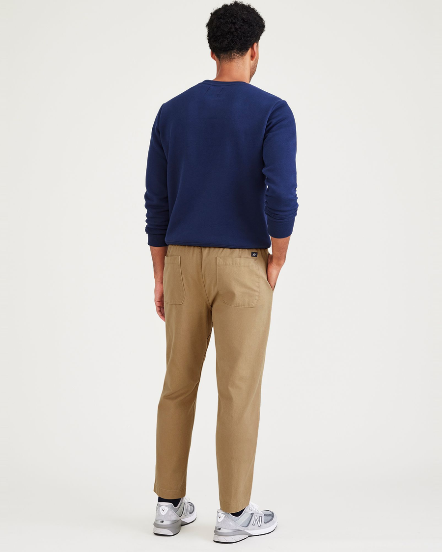 Back view of model wearing Otter Stone Canvas California Pull-On Khakis, Straight Tapered Fit.