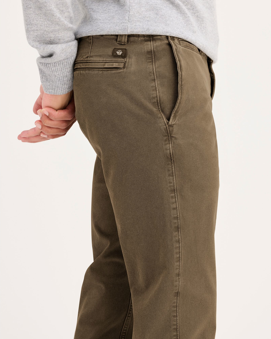 Side view of model wearing Otter Stone Wash Alpha Chino, Slim Fit.