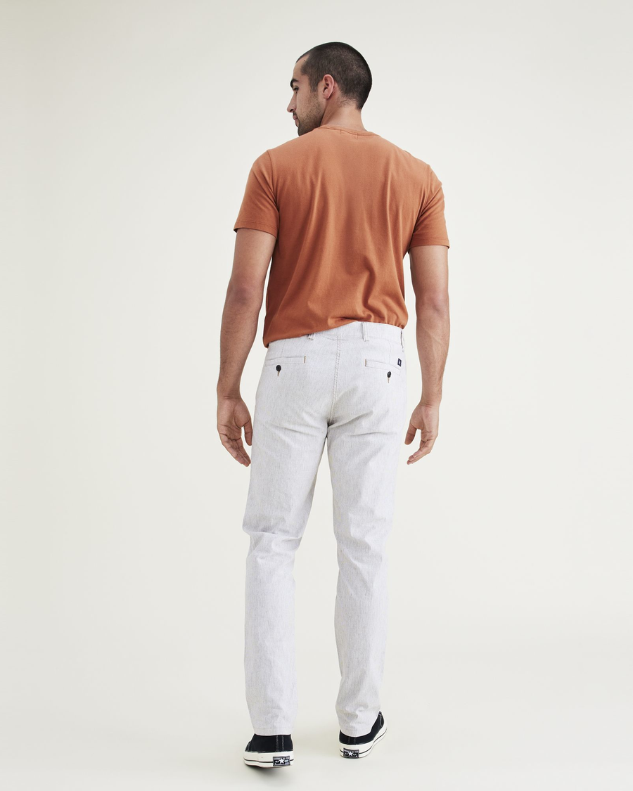Back view of model wearing Otter Ultimate Chinos, Slim Fit.