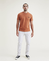 Front view of model wearing Otter Ultimate Chinos, Slim Fit.