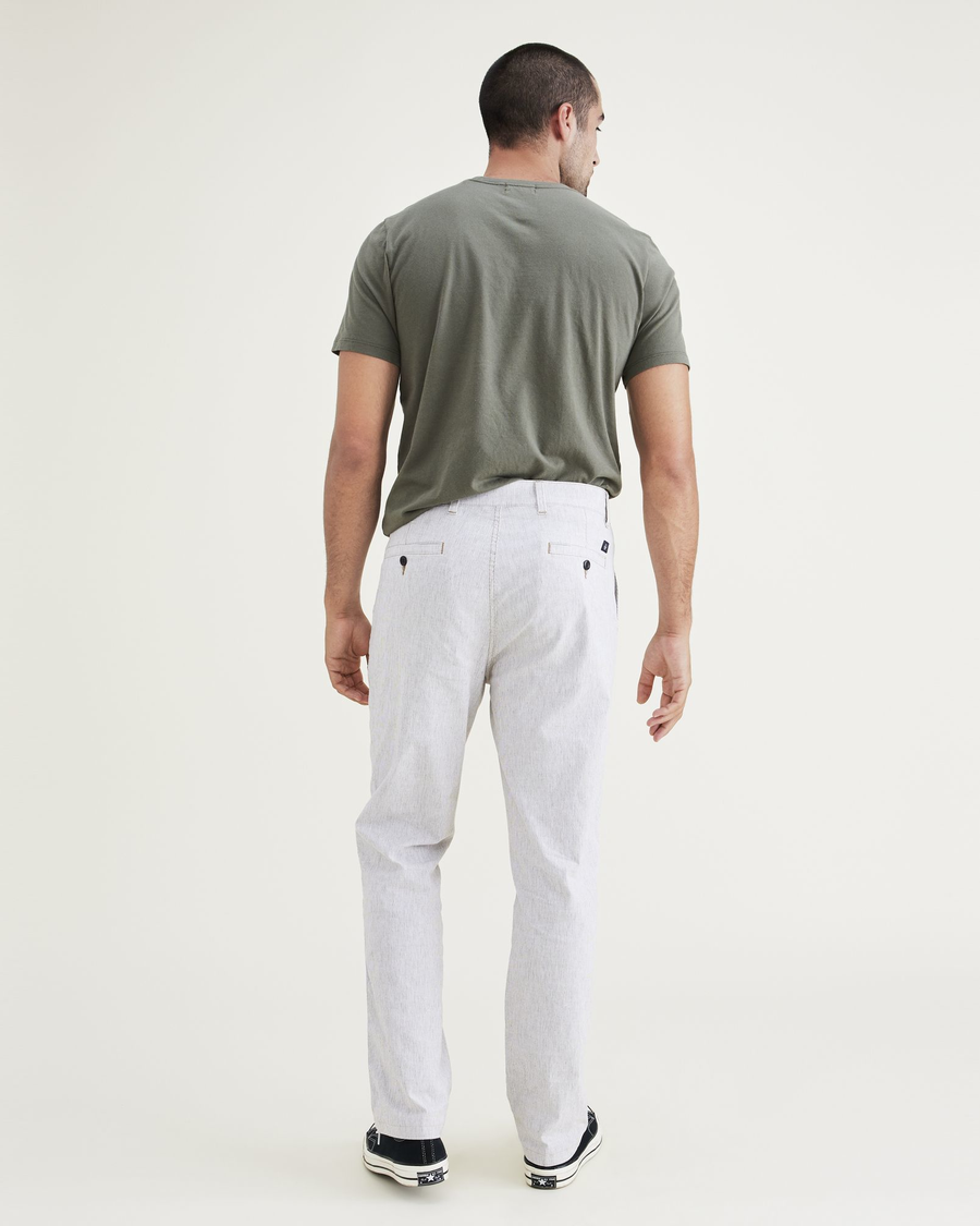 Back view of model wearing Otter Ultimate Chinos, Straight Fit.