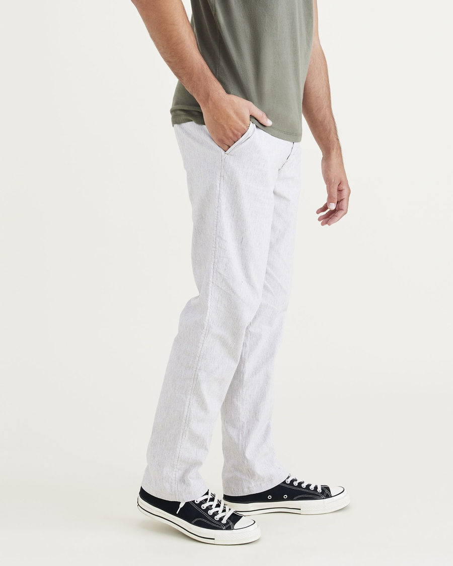 Side view of model wearing Otter Ultimate Chinos, Straight Fit.
