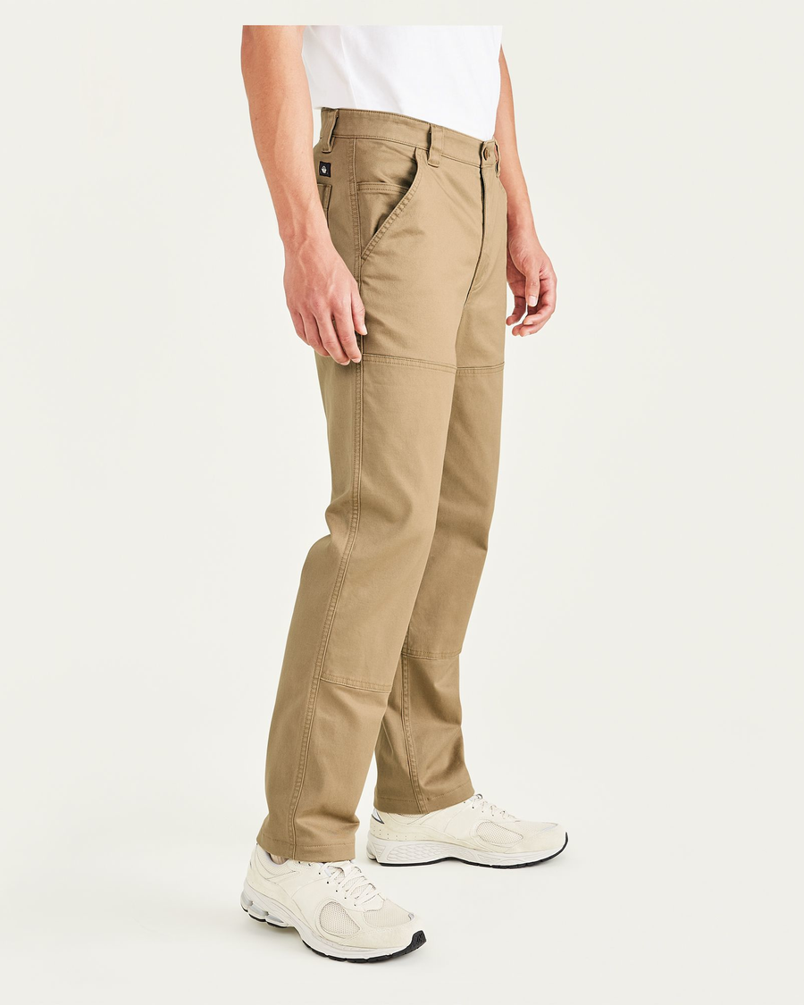 Side view of model wearing Otter Utility Pants, Straight Fit.