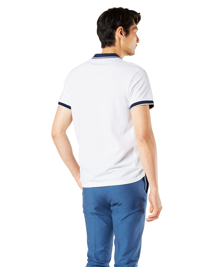 Back view of model wearing Paper White Performance Polo, Slim Fit.