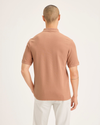 Back view of model wearing Peach Bloom Original Polo, Slim Fit.