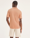 Back view of model wearing Peach Bloom Pique Polo, Slim Fit.