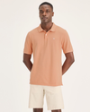 Front view of model wearing Peach Bloom Pique Polo, Slim Fit.