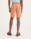 Back view of model wearing Peach Bloom Ultimate 9.5" Shorts.