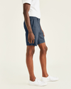 Side view of model wearing Pembroke Ultimate 9.5" Shorts, Straight Fit.