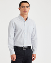 Front view of model wearing Pinnacle Lucent White Essential Button-Up Shirt, Classic Fit.
