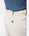 View of model wearing Porcelain Khaki Comfort Khakis, Pleated, Relaxed Fit.