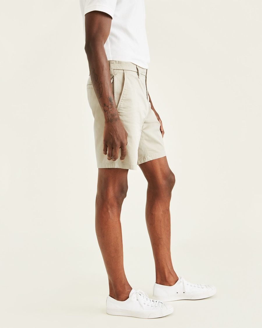 Side view of model wearing Porcelain Khaki Ultimate 9.5" Shorts (Big and Tall).