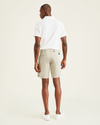 Back view of model wearing Porcelain Khaki Ultimate 9.5" Shorts, Straight Fit.