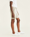 Side view of model wearing Porcelain Khaki Ultimate 9.5" Shorts, Straight Fit.