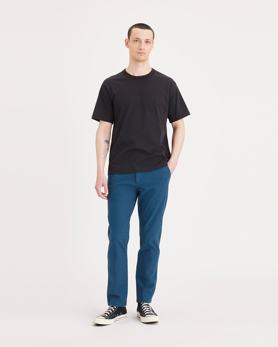 Front view of model wearing Poseidon Blue Ultimate Chino, Slim Fit.