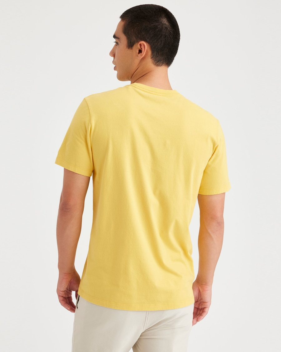 Back view of model wearing Primrose Yellow Crewneck Tee, Slim Fit.