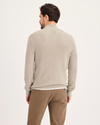 Back view of model wearing Pure Cashmere 1/4 Zip Sweater, Regular Fit.