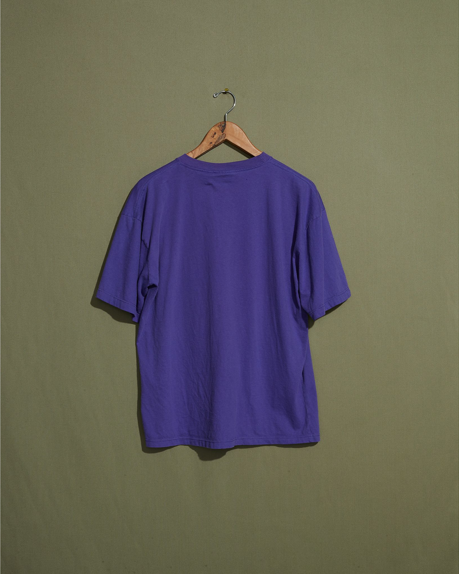 Back view of model wearing Purple Made in USA, Purple Embroidered Tee - M.