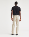 Back view of model wearing Sahara Khaki Essential Chinos, Pleated, Classic Fit.