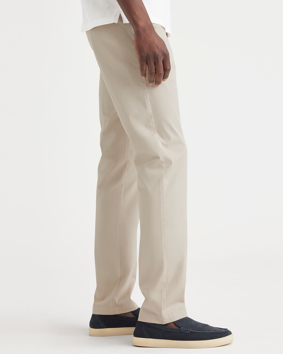 Side view of model wearing Sahara Khaki Essential Chinos, Slim Fit.